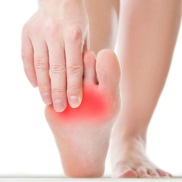 Person holding foot with highlighted area indicating pain, representing common foot issues addressed at Opensky Podiatry, Inc.